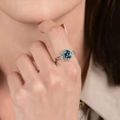 Enchanted Disney Fine Jewelry Sterling Silver with 1/10 CTTW Diamond and London Blue Topaz Cinderella 70th Ring