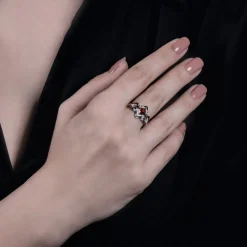 Enchanted Disney Fine Jewelry The de Vil is in the Details Sterling Silver and Black Rhodium 1/5 CTTW Diamond and Garnet Disney Cruella Live Action Ring