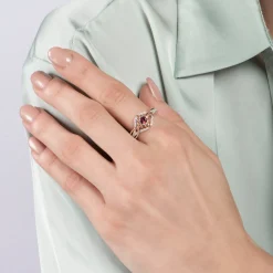Enchanted Disney Fine Jewelry Sterling Silver and 10K Rose Gold with 1/6 CTTW Diamond and Rhodolite Garnet Anna Ring