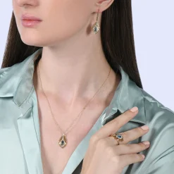 Enchanted Disney Fine Jewelry 10K Yellow Gold with 1/8 CTTW Diamonds and Swiss Blue Topaz Jasmine Peacock Feather Pendant Necklace